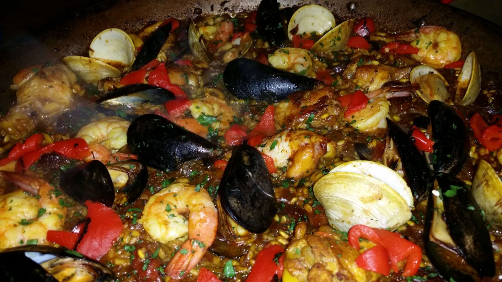 closeup shot of the paella with shrimp and clams