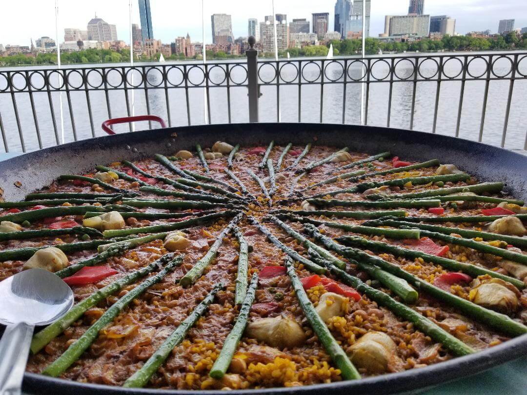 a big pan of paella with asparagus