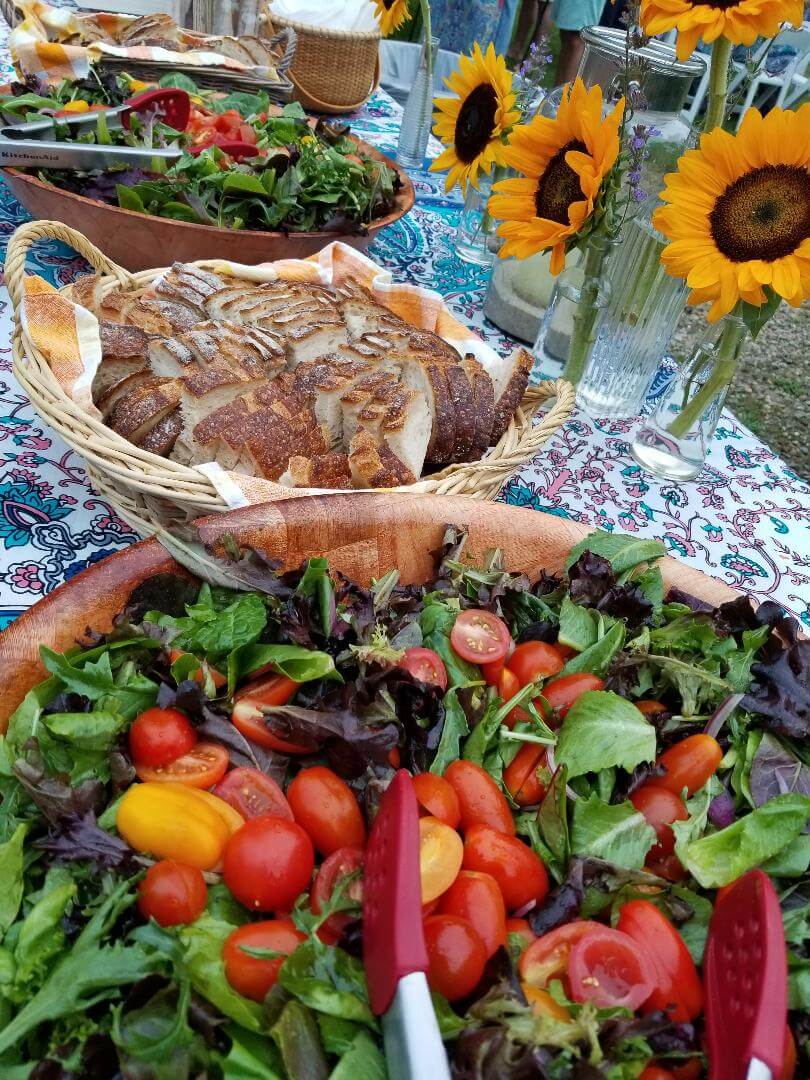 closeup shot of the salad bowl and bread basket