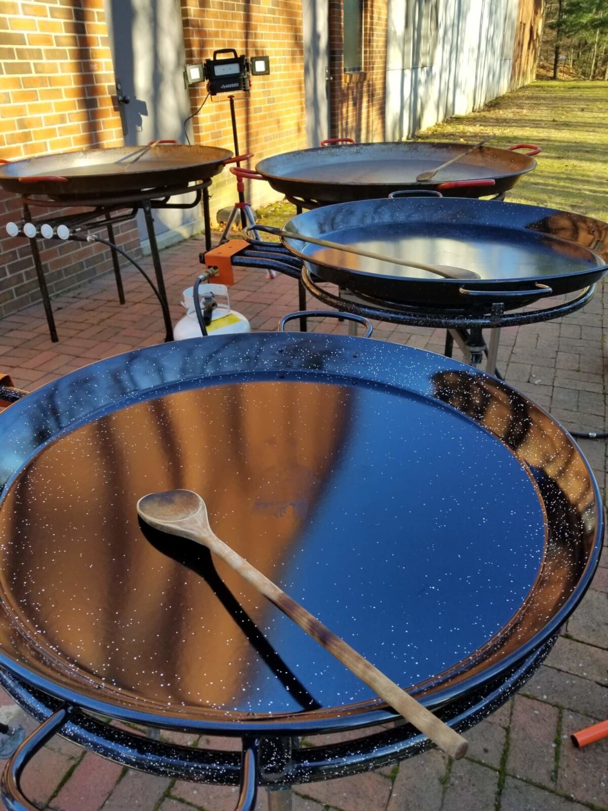 four empty pans for cooking Christmas Paellas