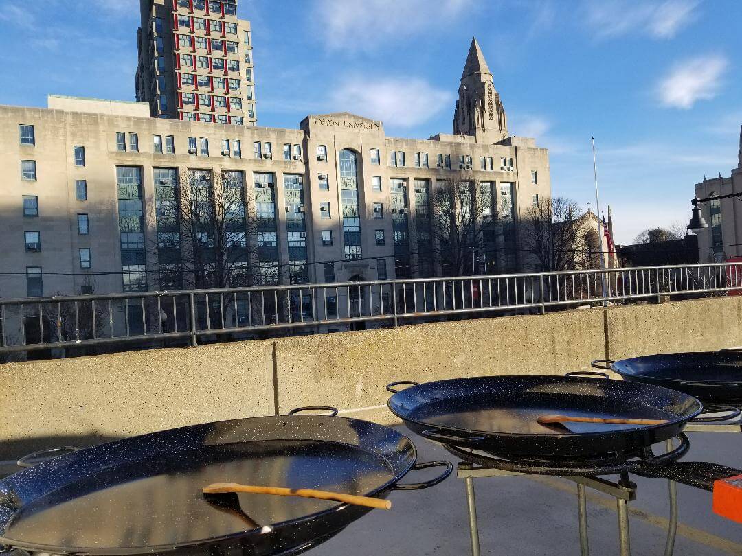 Three black big empty pans on the rooftop