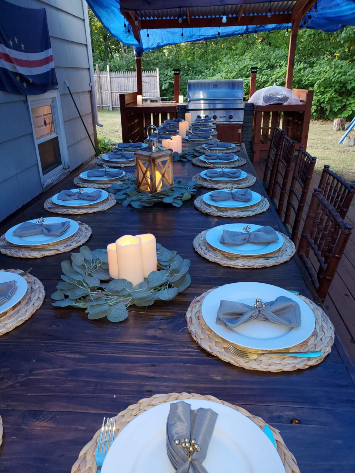 a decorated dining table with plates and candles
