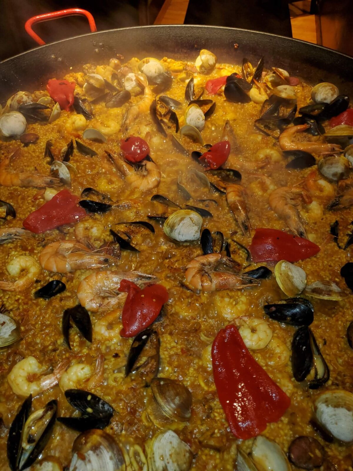 delicious Paella with shrimp, peppers, and clams