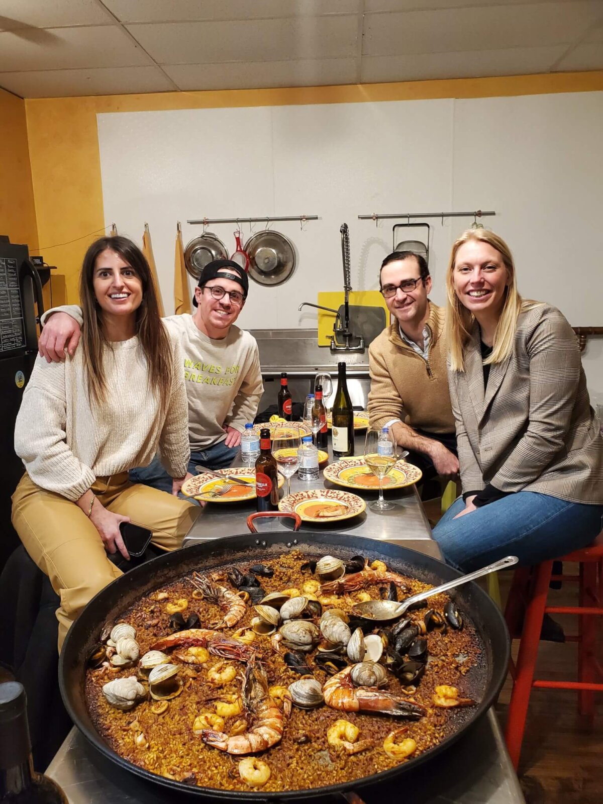 two couples enjoying the Paella dinner